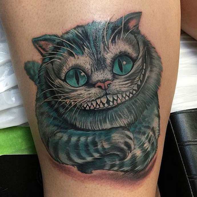 signification du tatouage du chat du Cheshire