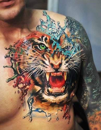 Le sourire du tigre. Photo, signification, sur l'épaule, le sternum, le bras, la jambe