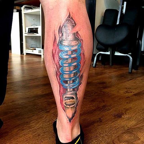 Amortisseur de tatouage sur la jambe. Photo, signification, croquis
