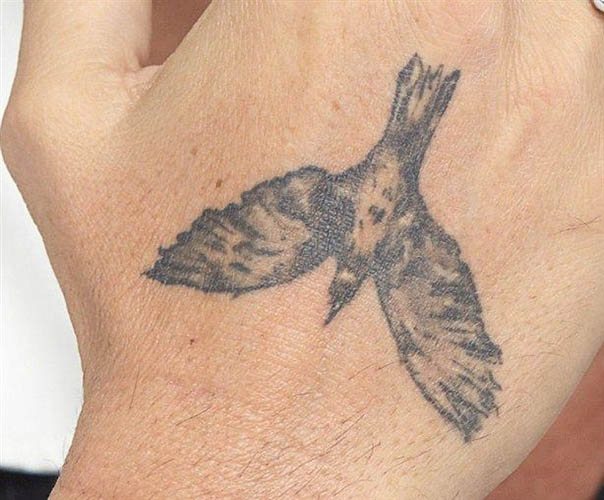 Un tatouage de Johnny Depp. Photos sur son bras, son dos et sa main