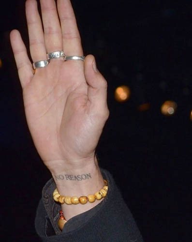 Un tatouage de Johnny Depp. Photos sur son bras, son dos et sa main