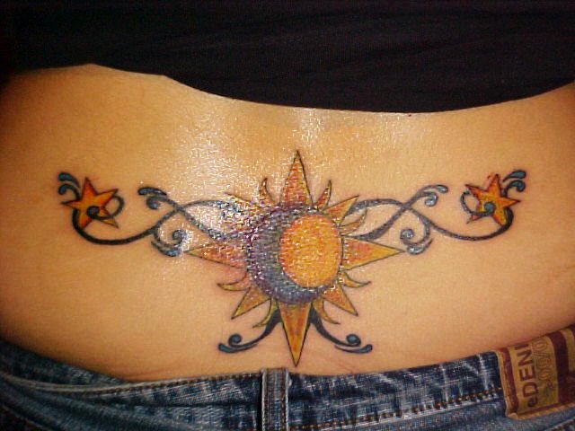 Tatouage sur le coccyx pour les filles. Photo et signification