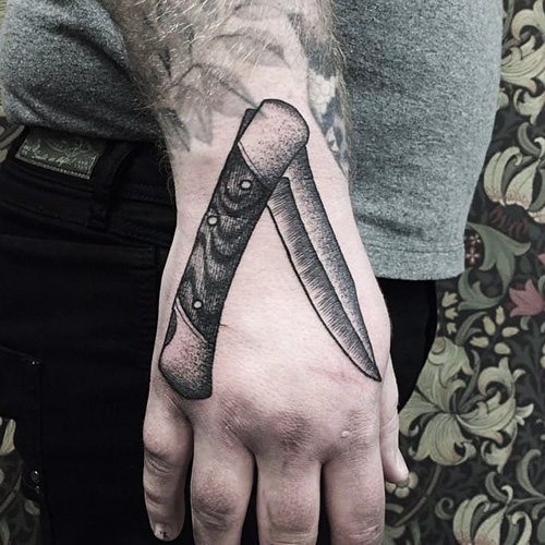 Couteau Tattoo Papillon. Photo, signification, croquis de la rose, l'inscription, une toile d'araignée