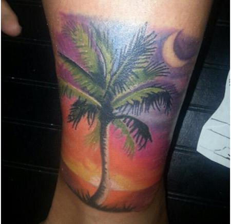 Photo du tatouage Palm sur sa jambe