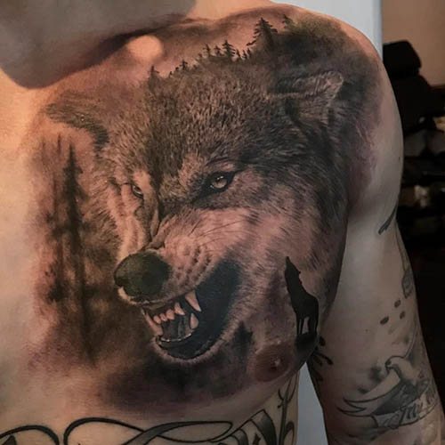 Un tatouage de sourire de loup. Photo, signification sur l'épaule, l'avant-bras, le dos, le bras