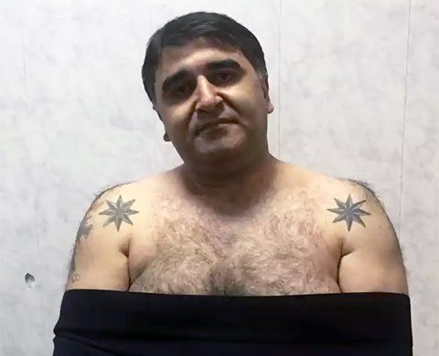 Lutteur russe de la loi Nodar Aloyan - Nodar Tbilissi avec un tatouage de prison d'une rose des vents